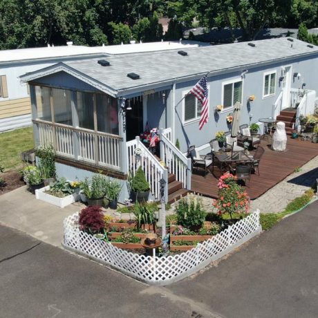 aerial view of twin cedars home with porch