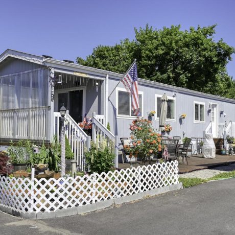 home exterior with plants and fence